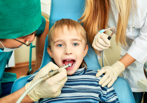 Shot of a little boy with dentists in a dental surgery. Healthcare, medicine.